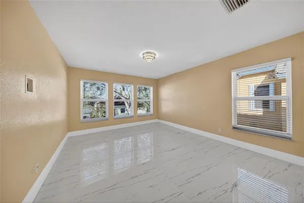 a view of an empty room with a window