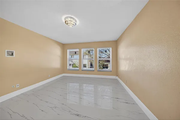 a view of an empty room with a window