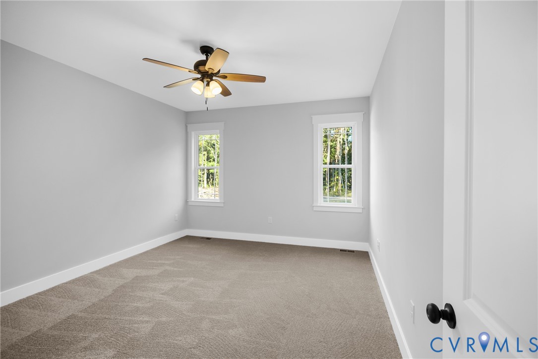 19106 Carson Road Dinwiddie, VA 23841 - Photo 17 of 34 First floor. Neutral wall paint, plush carpet floo
