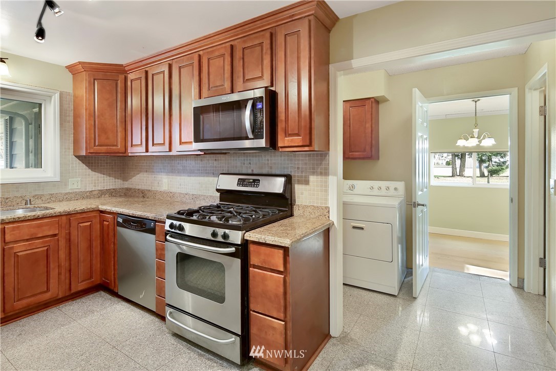 171 East Pole Road Lynden, WA 98264 - Photo 12 of 39 a kitchen with white cabinets and stainless steel appliances