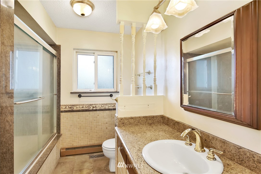 171 East Pole Road Lynden, WA 98264 - Photo 17 of 39 a bathroom with a granite countertop sink toilet and shower
