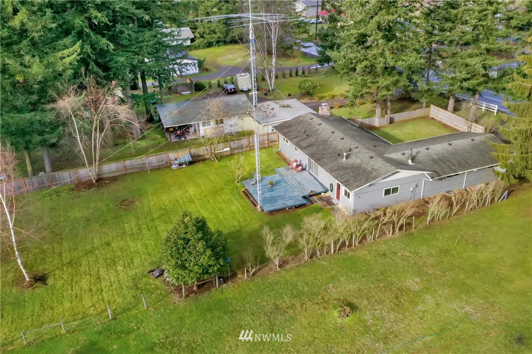 171 East Pole Road Lynden, WA 98264 - Photo 32 of 39 an aerial view of a house with swimming pool and large trees