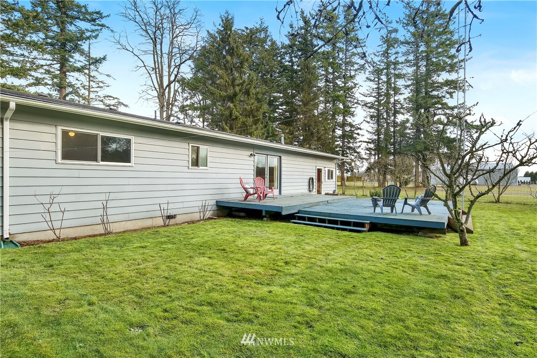 171 East Pole Road Lynden, WA 98264 - Photo 34 of 39 a front view of a house with a garden and trees