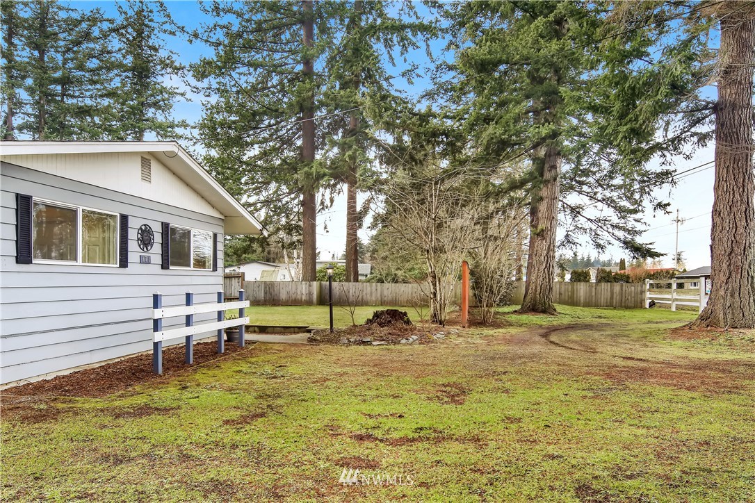 171 East Pole Road Lynden, WA 98264 - Photo 37 of 39 a backyard of a house with table and chairs