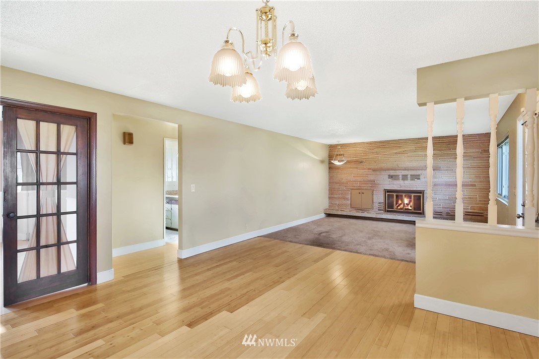171 East Pole Road Lynden, WA 98264 - Photo 5 of 39 a view of an empty room with wooden floor and a window