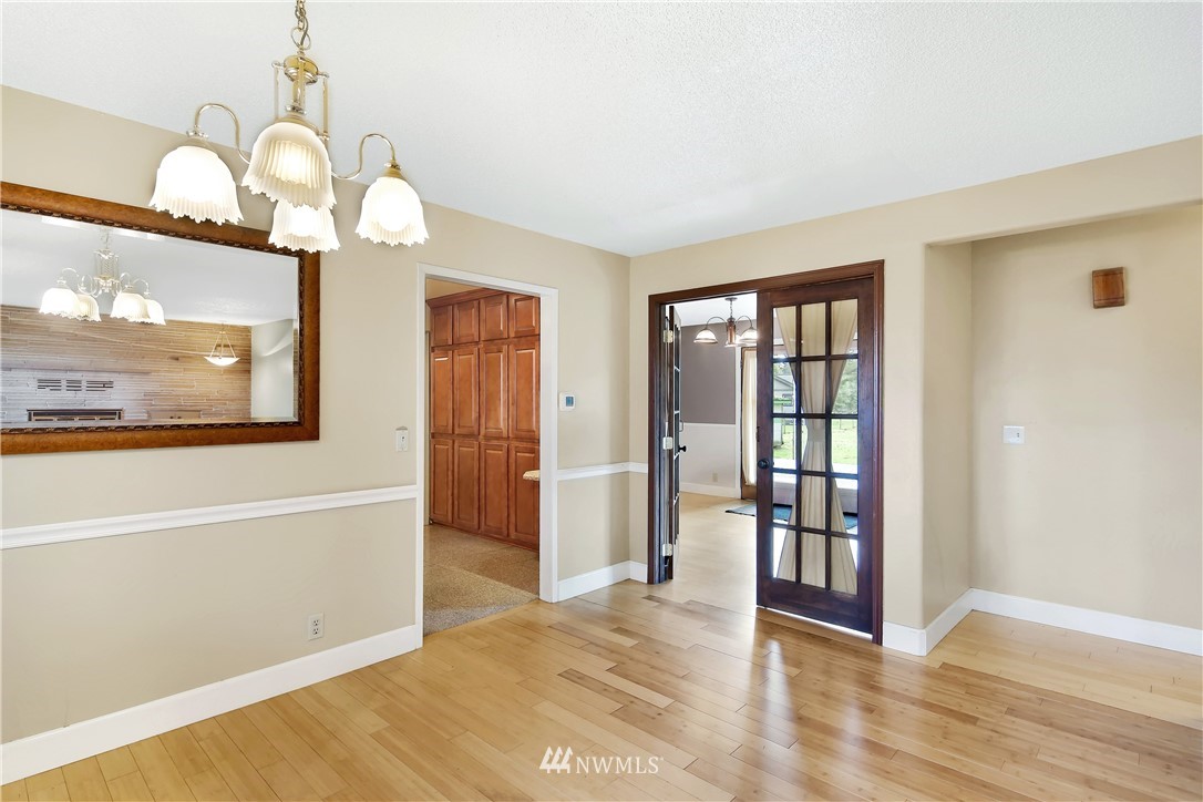 171 East Pole Road Lynden, WA 98264 - Photo 7 of 39 a view of a big room with wooden floor fan and windows