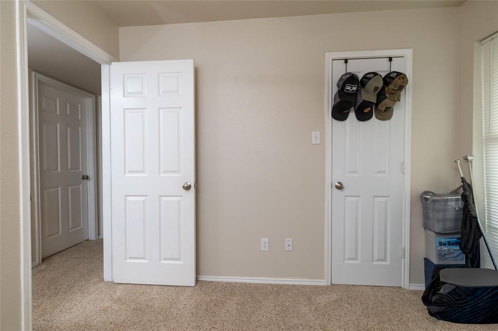 401 Berryhill Drive Springtown, TX 76082 - Photo 18 of 26 a view of a closet with storage