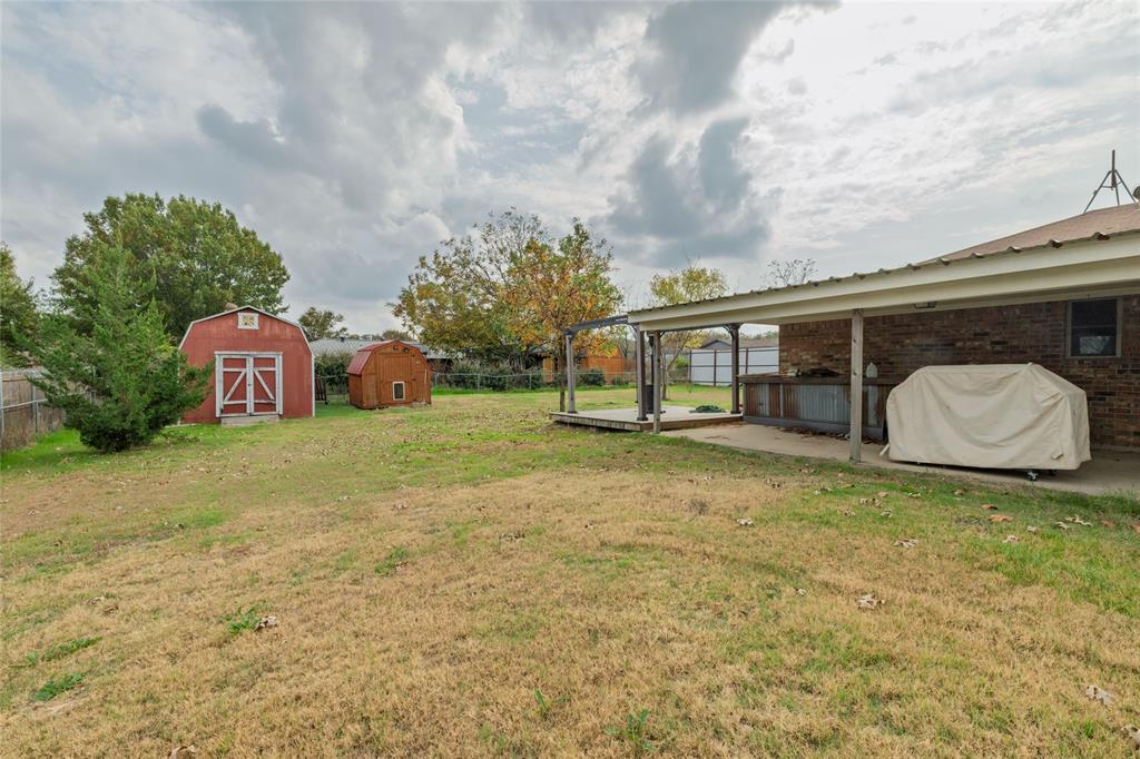 401 Berryhill Drive Springtown, TX 76082 - Photo 25 of 26 a house view with a garden space