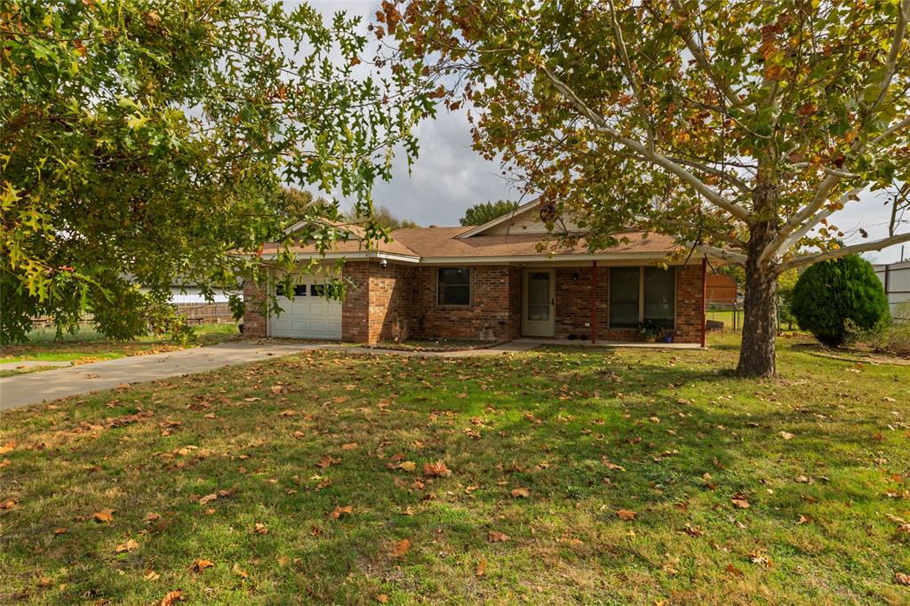 401 Berryhill Drive Springtown, TX 76082 - Photo 3 of 26 a view of a house with a yard