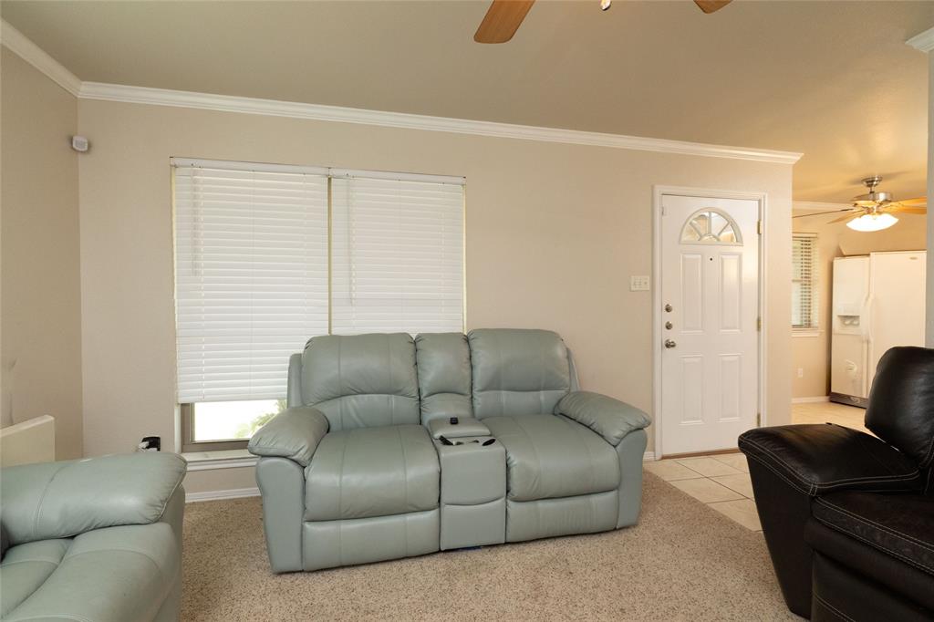 401 Berryhill Drive Springtown, TX 76082 - Photo 5 of 26 a living room with a couch and a window