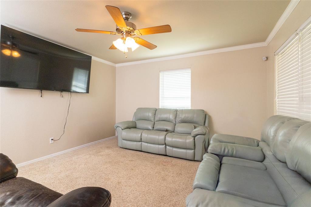 401 Berryhill Drive Springtown, TX 76082 - Photo 6 of 26 a living room with furniture and a flat screen tv
