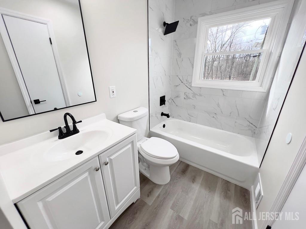 1273 Brookside Road Piscataway, NJ 08854 - Photo 19 of 33 a bathroom with a sink and a mirror