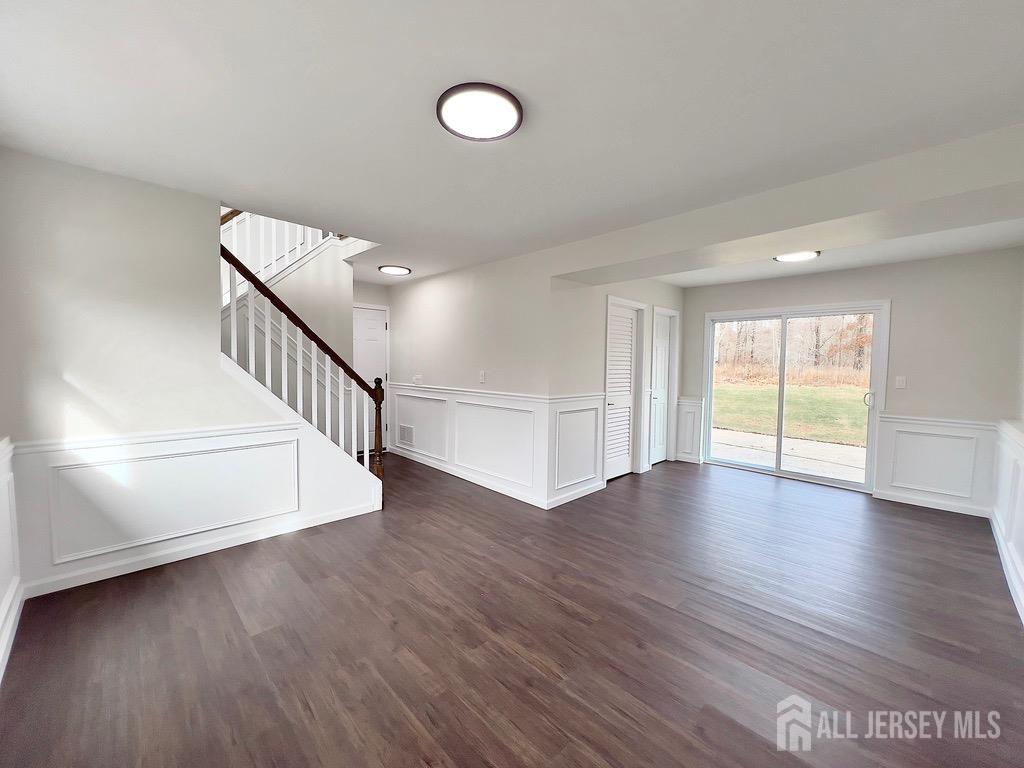 1273 Brookside Road Piscataway, NJ 08854 - Photo 23 of 33 a view of an empty room with wooden floor and fan