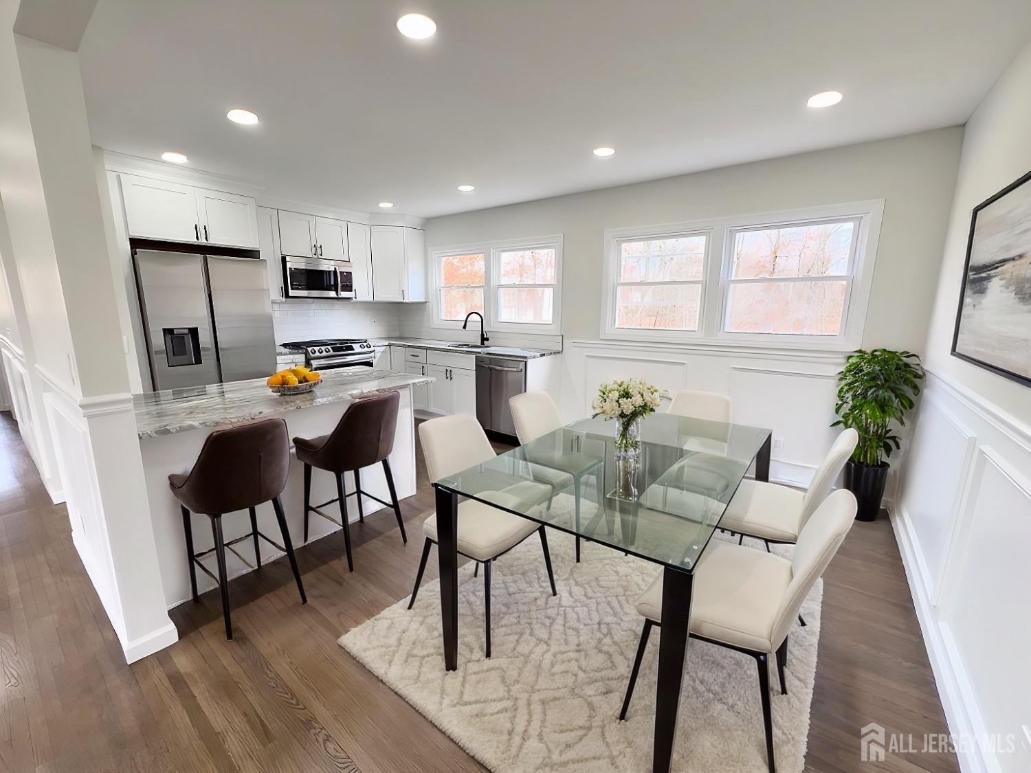 1273 Brookside Road Piscataway, NJ 08854 - Photo 3 of 33 a view of a dining room with furniture window and wooden floor