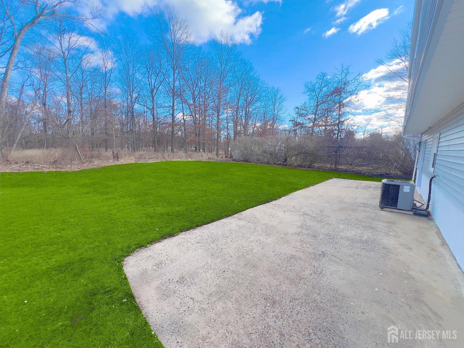 1273 Brookside Road Piscataway, NJ 08854 - Photo 31 of 33 a view of a backyard with large tree