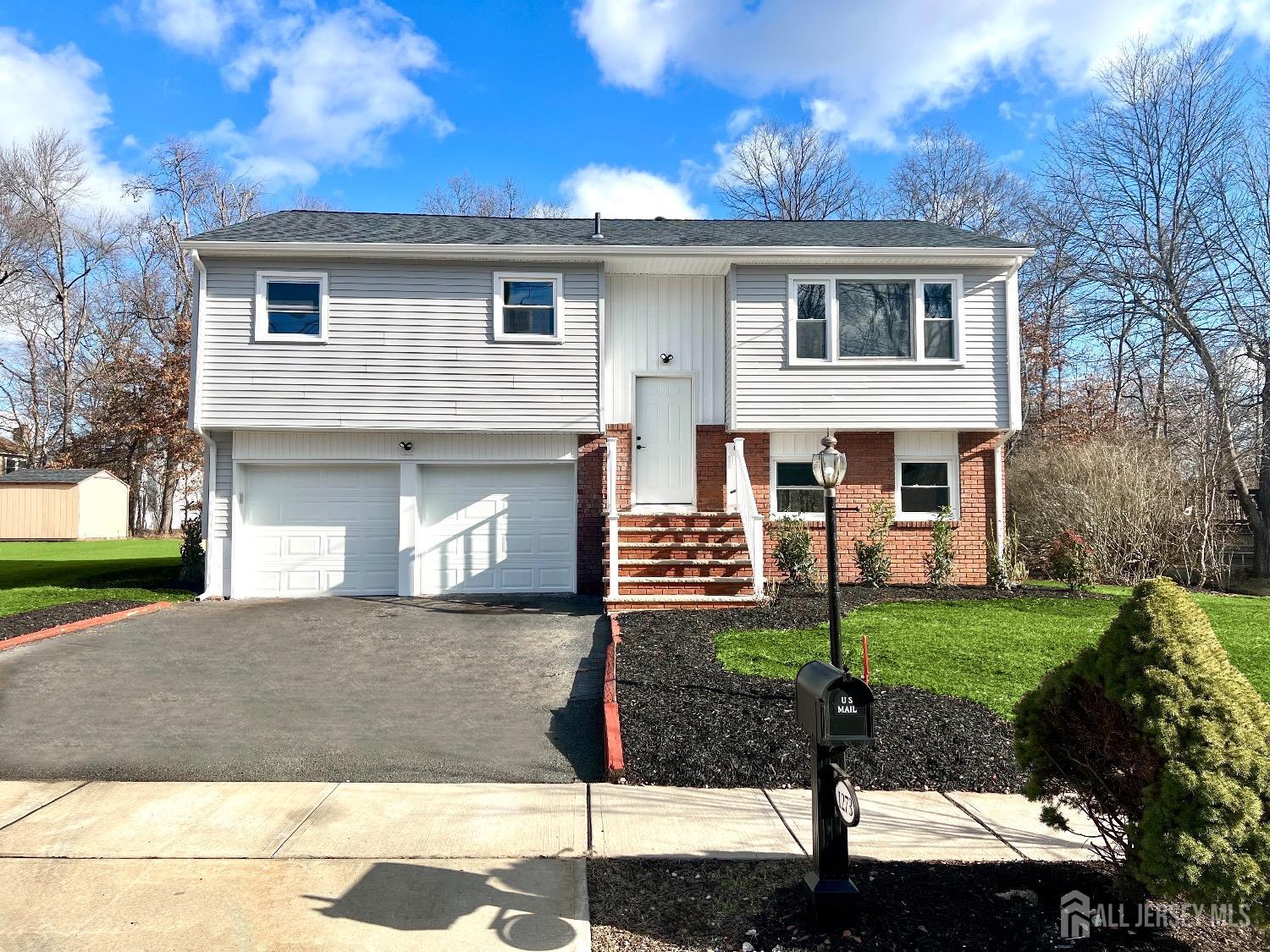 1273 Brookside Road Piscataway, NJ 08854 - Photo 32 of 33 a front view of a house with a yard