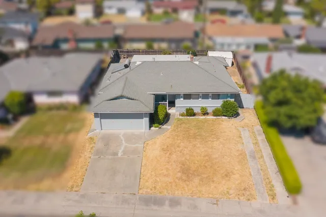 a aerial view of a house with swimming pool