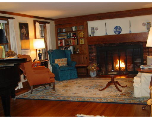 25 Ross Road Belmont, MA 02478 - Photo 3 of 4 a living room with furniture and a fireplace