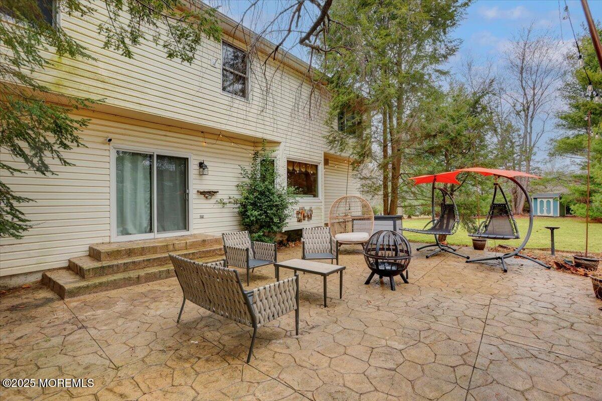 210 Hunt Road Freehold, NJ 07728 - Photo 15 of 39 a view of a house with backyard and sitting area
