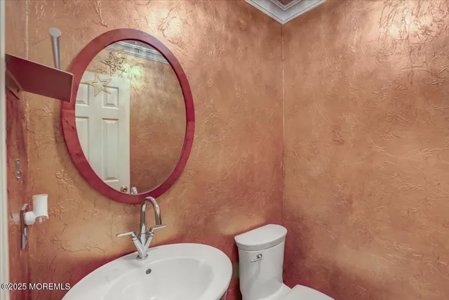 a bathroom with a toilet and a sink