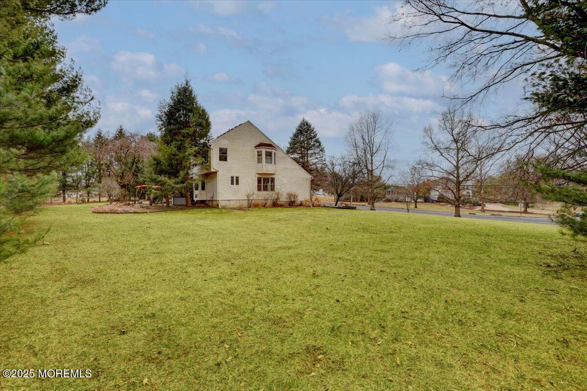 210 Hunt Road Freehold, NJ 07728 - Photo 18 of 39 a view of a field with large trees