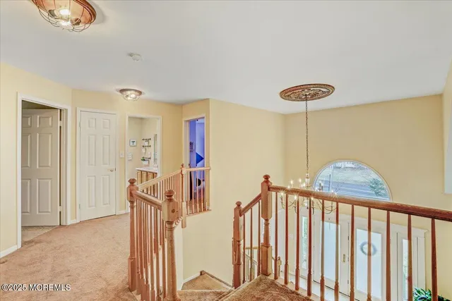 a view of a hallway with windows