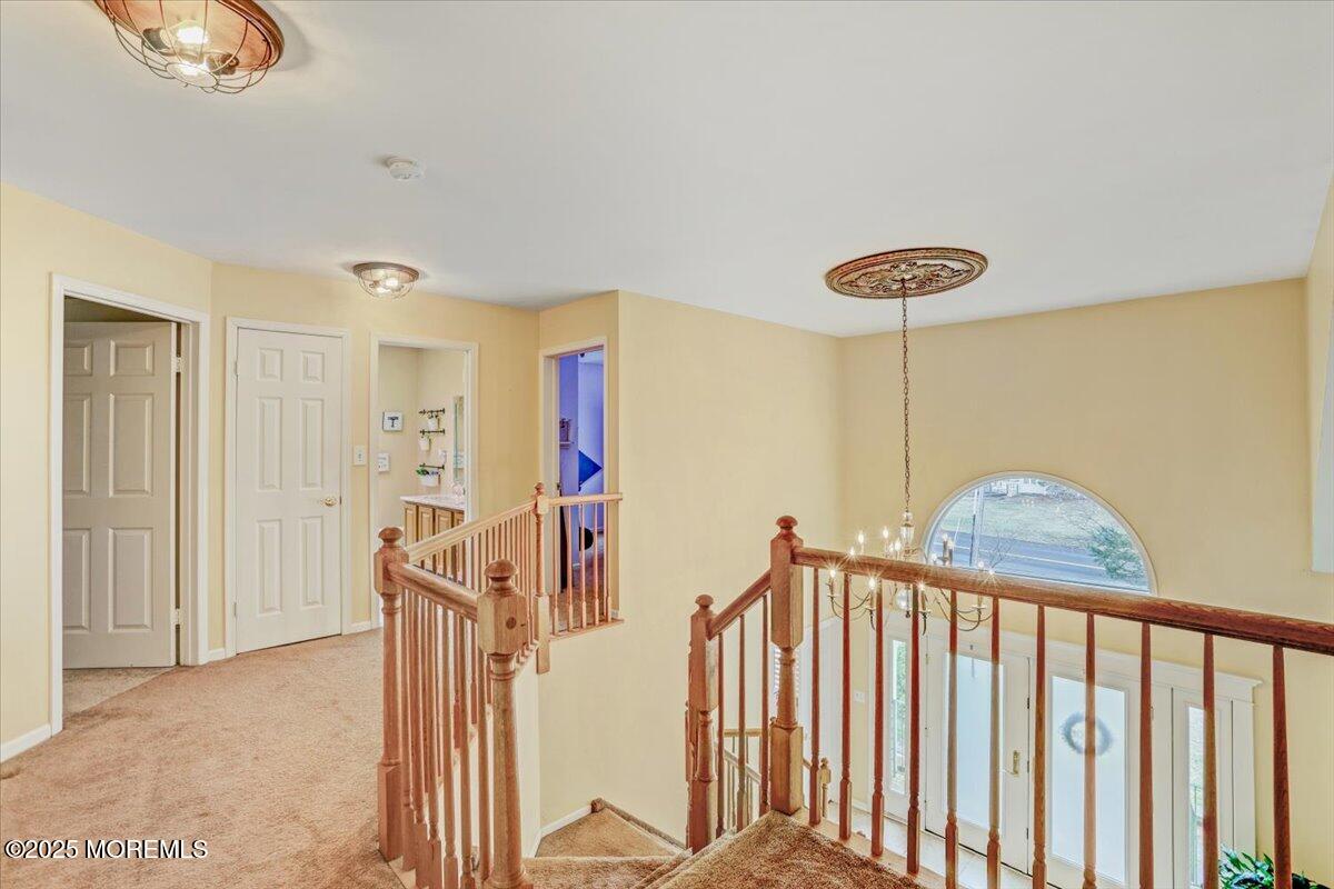 210 Hunt Road Freehold, NJ 07728 - Photo 30 of 39 a view of a hallway with windows
