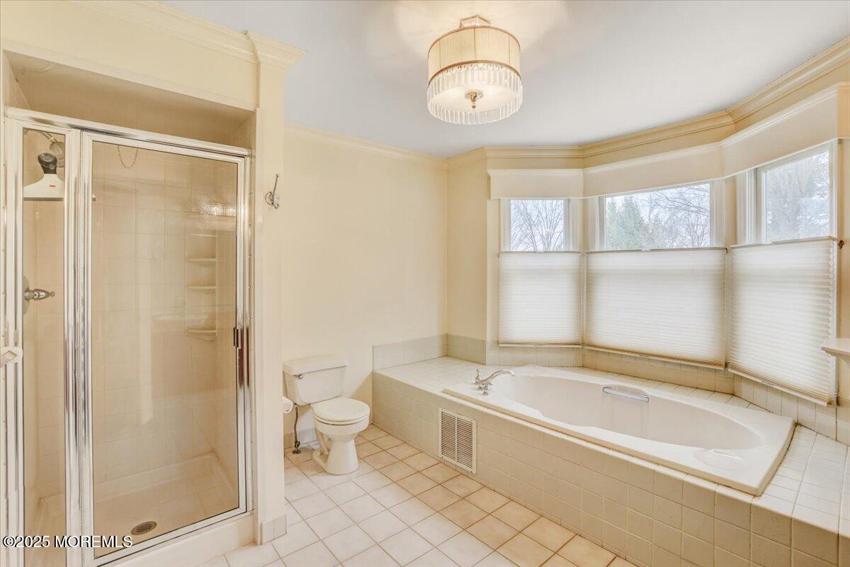 210 Hunt Road Freehold, NJ 07728 - Photo 34 of 39 a spacious bathroom with a bathtub and a shower