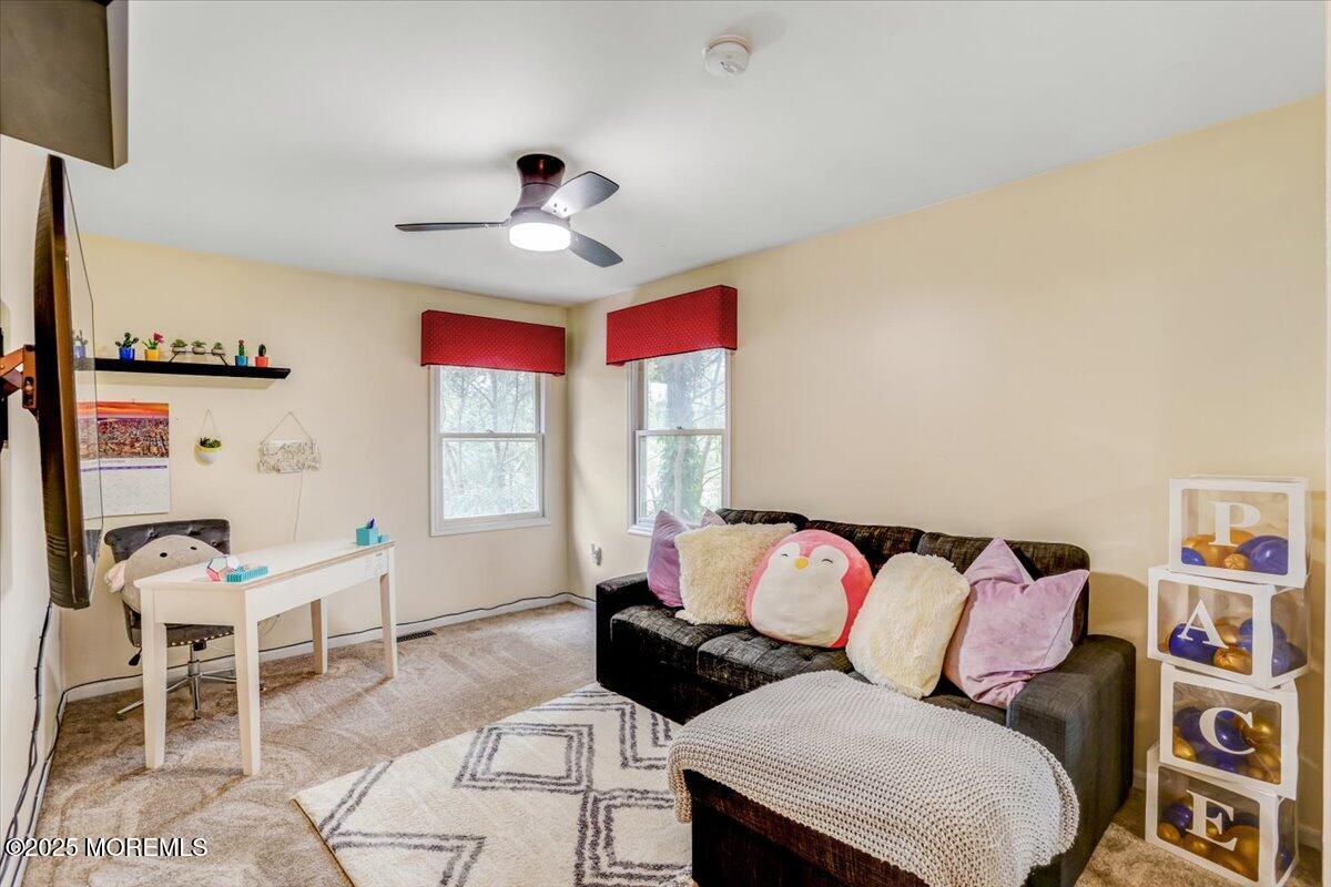 210 Hunt Road Freehold, NJ 07728 - Photo 36 of 39 a living room with furniture and a large window