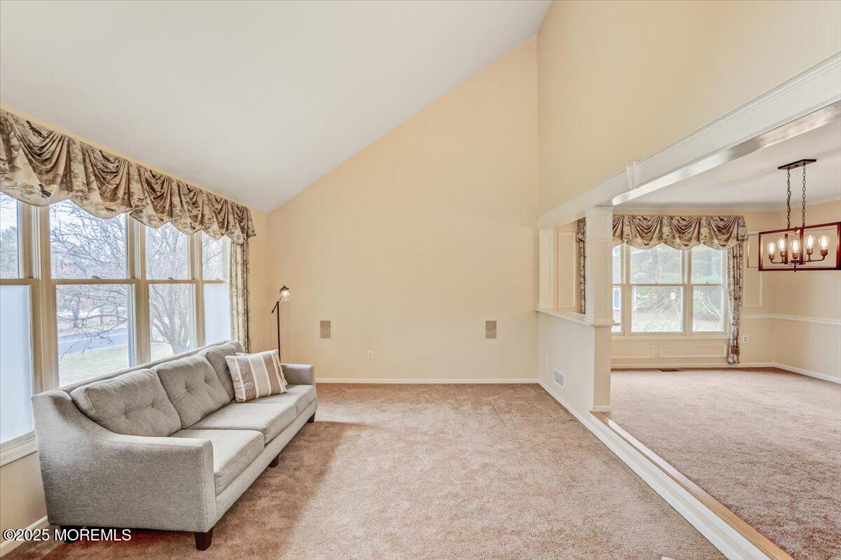 210 Hunt Road Freehold, NJ 07728 - Photo 8 of 39 a living room with furniture and a large window