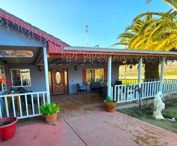 a view of a porch with furniture and a porch