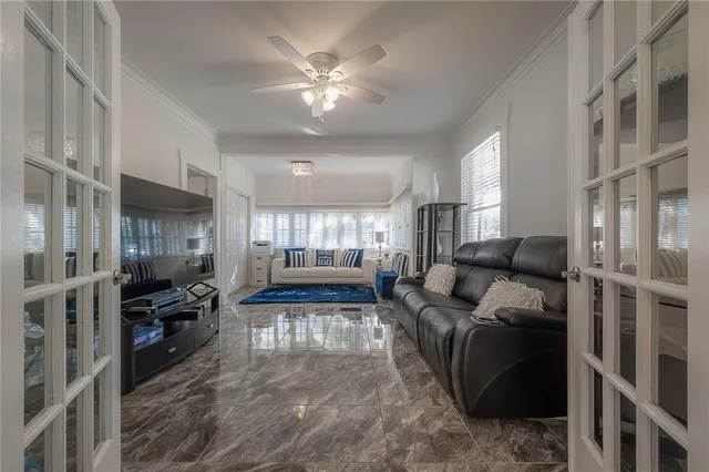 a living room with furniture and a large window
