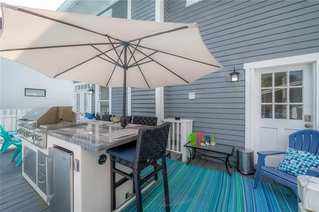 a view of a backyard with swimming pool