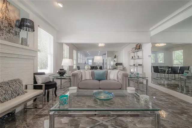 a large kitchen with a lot of white cabinets