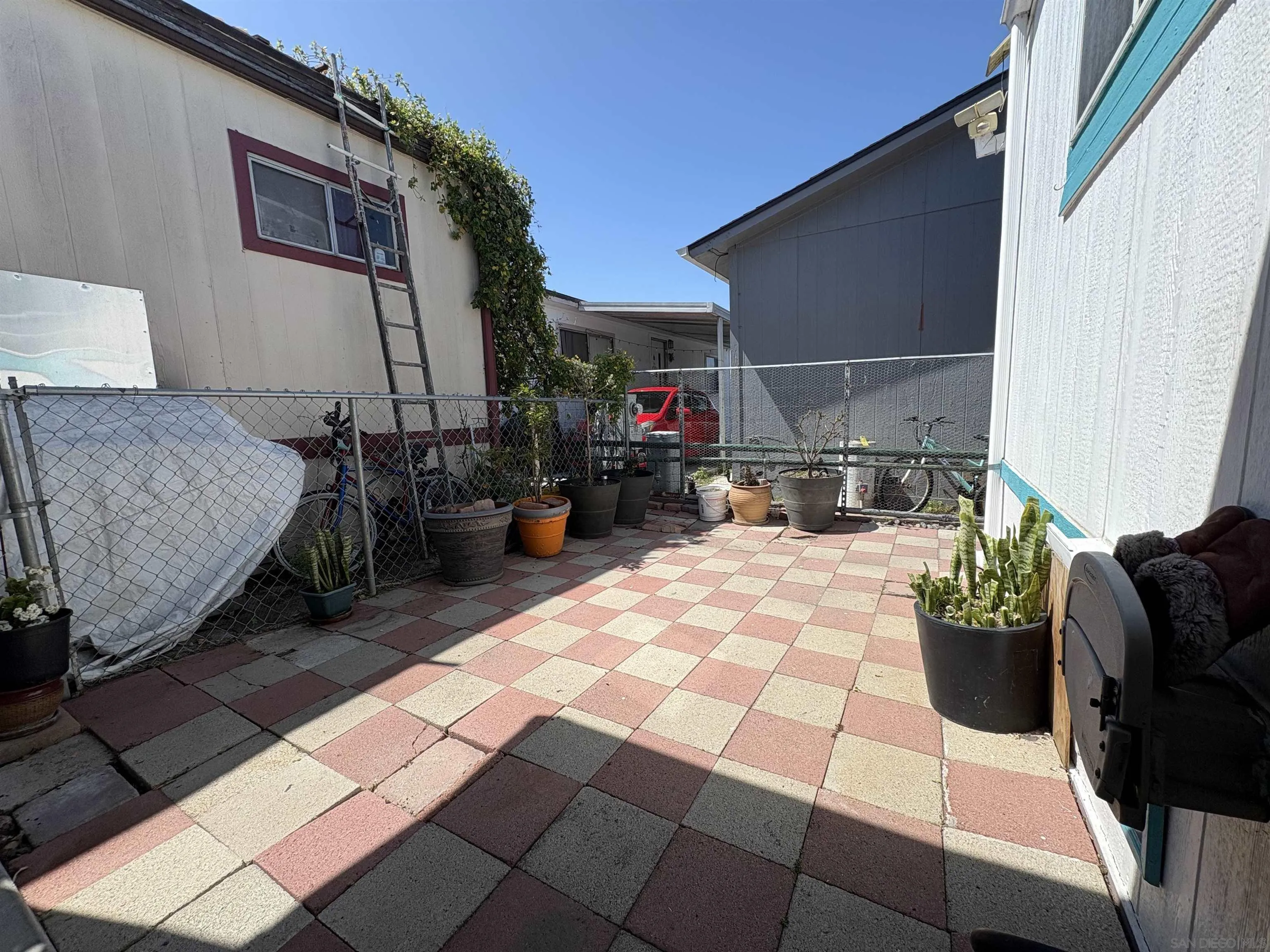 402 63rd Street, Unit 99 San Diego, CA 92114 - Photo 3 of 15 a living room with furniture and a couch