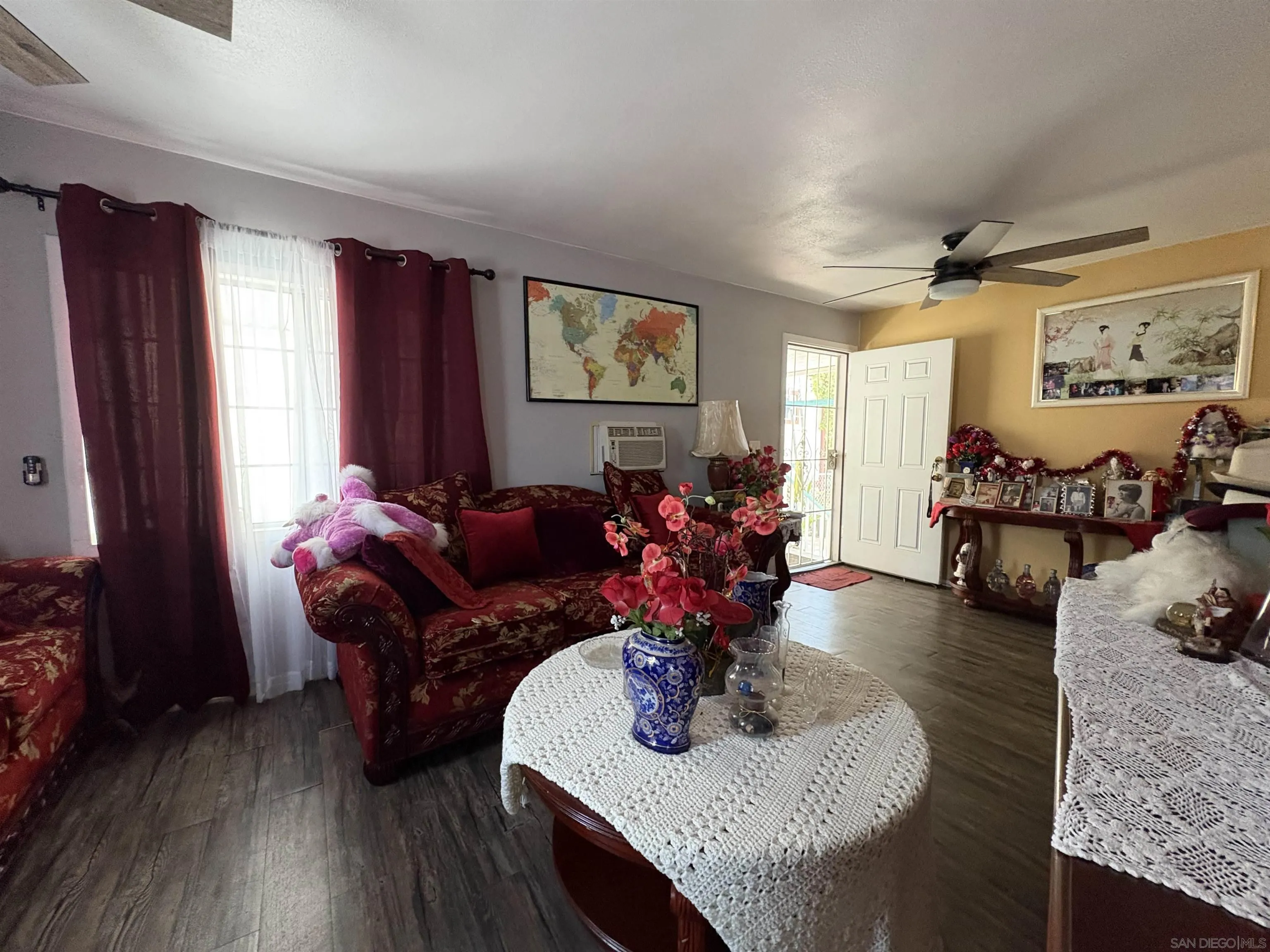 402 63rd Street, Unit 99 San Diego, CA 92114 - Photo 4 of 15 a living room with furniture and wooden floor