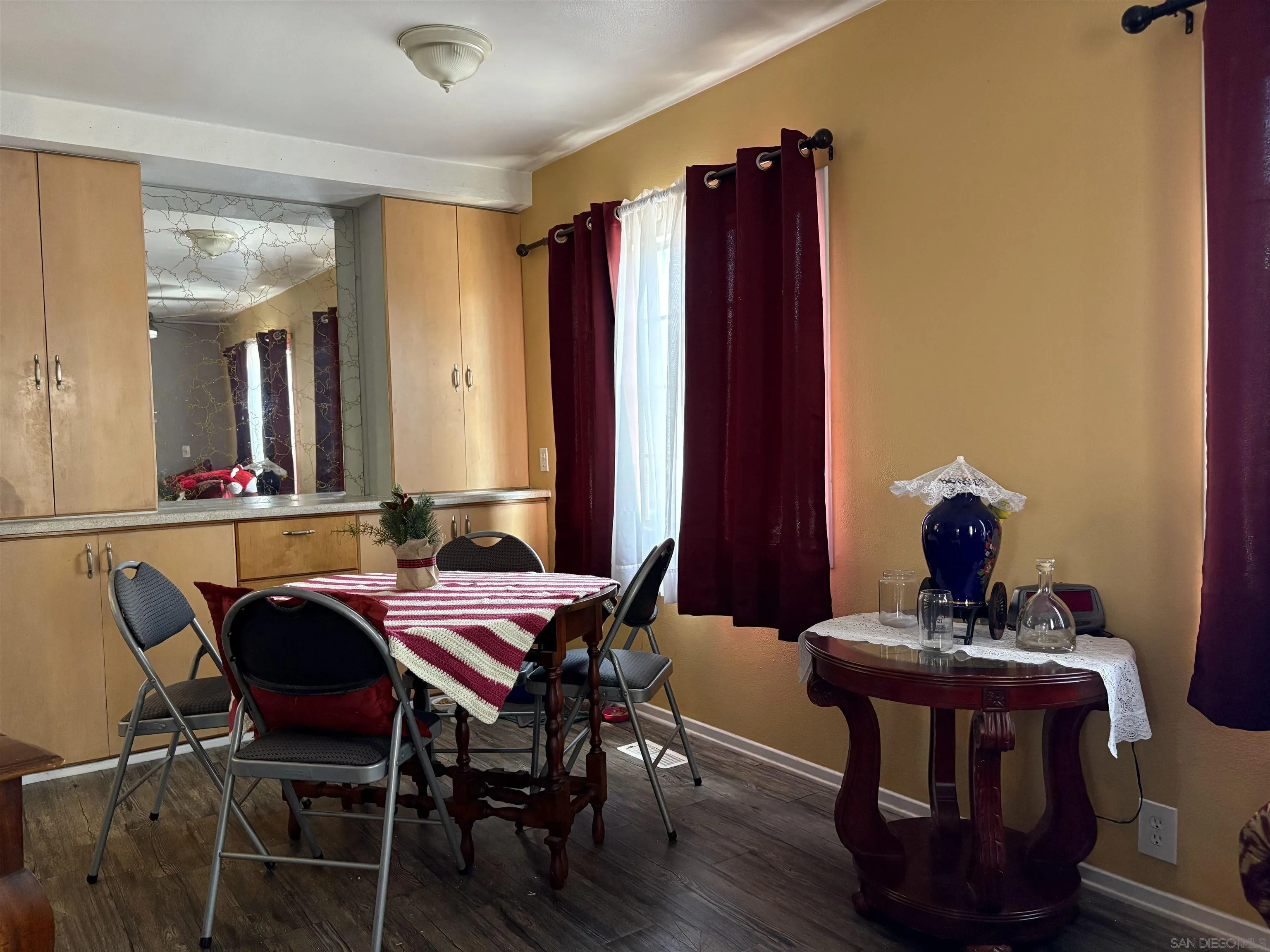 402 63rd Street, Unit 99 San Diego, CA 92114 - Photo 6 of 15 a view of a dining room with furniture and wooden floor