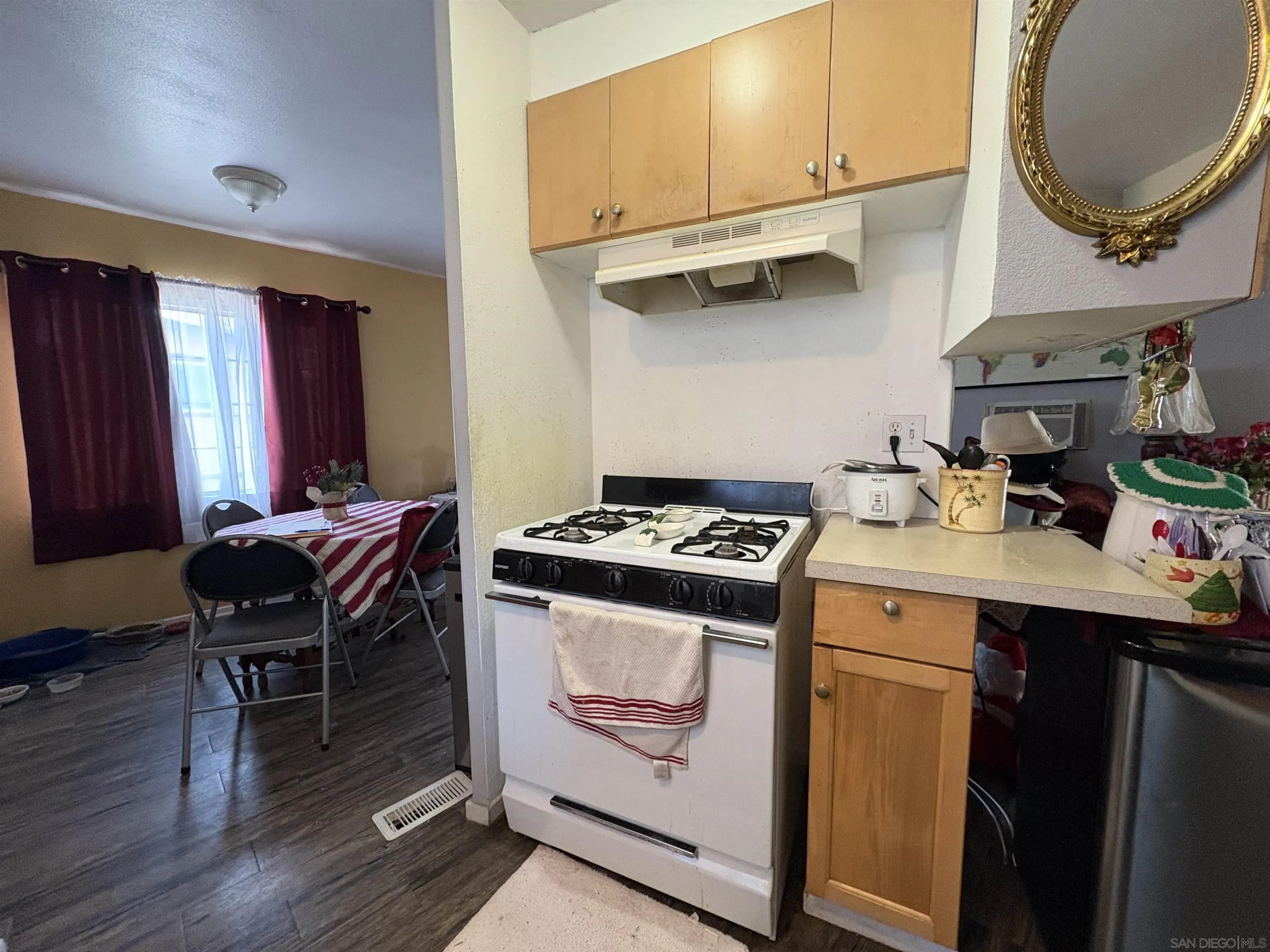 402 63rd Street, Unit 99 San Diego, CA 92114 - Photo 8 of 15 a kitchen with a stove and a refrigerator