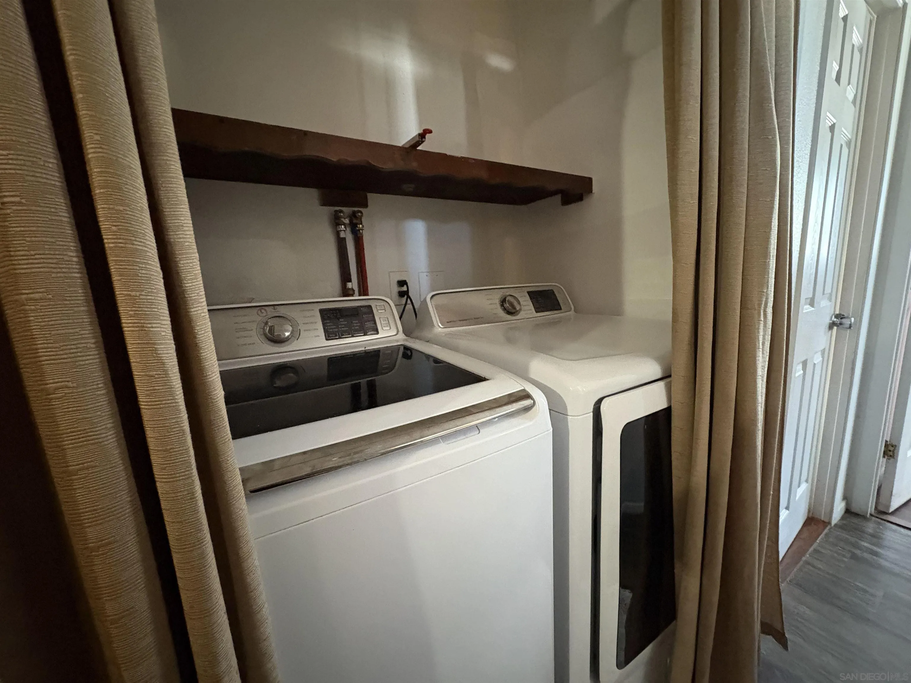 402 63rd Street, Unit 99 San Diego, CA 92114 - Photo 10 of 15 a utility room with dryer and washer