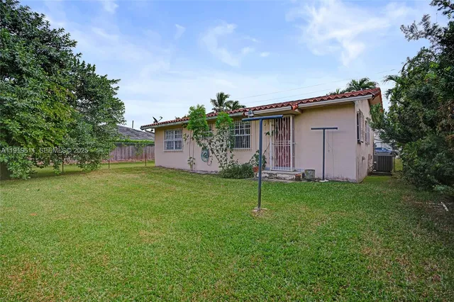 a backyard of a house with lots of green space