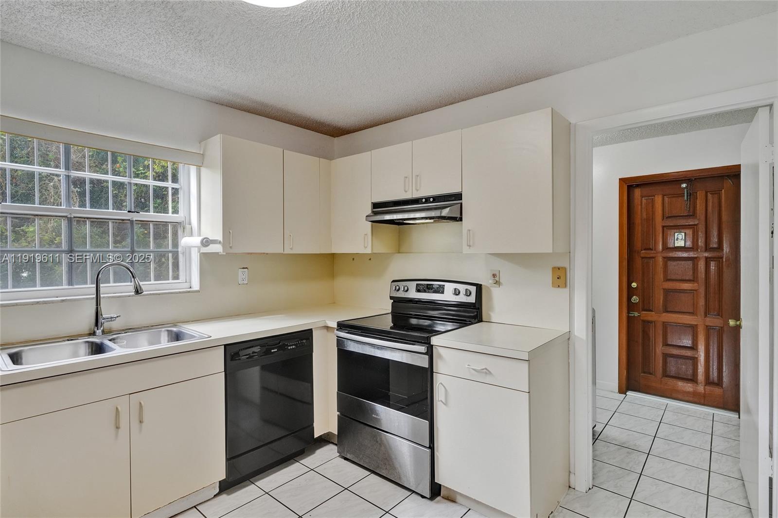 13401 Southwest 38th Street Miami, FL 33175 - Photo 18 of 45 a kitchen with a stove and a sink