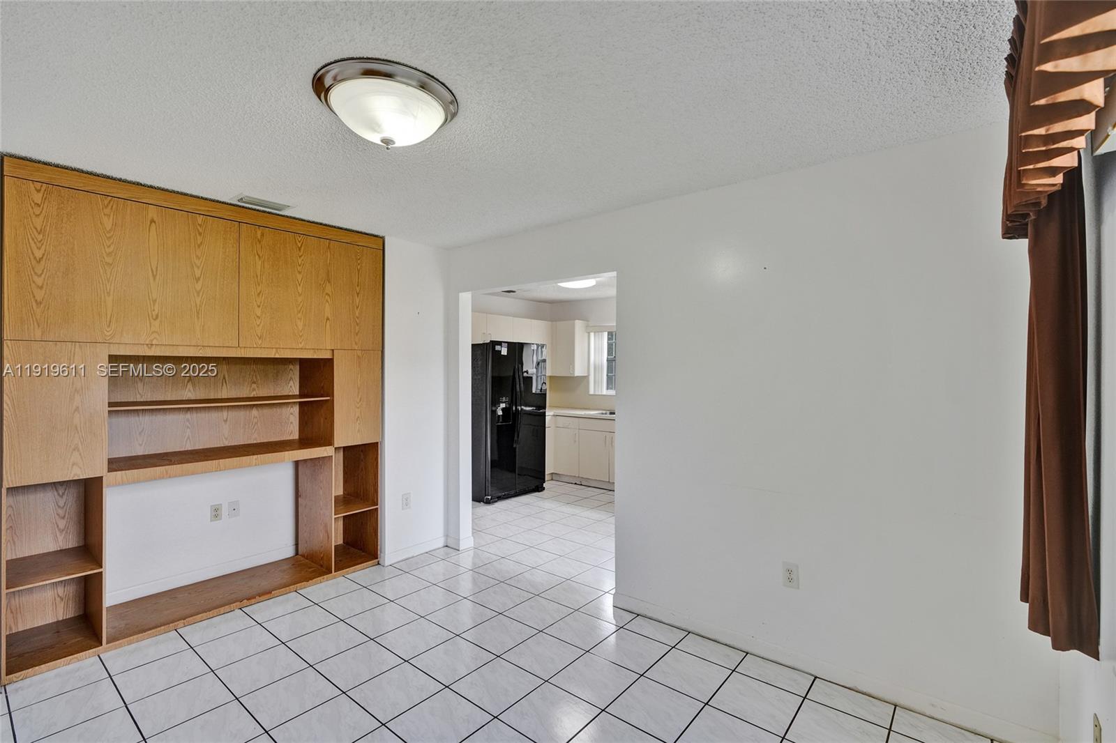 13401 Southwest 38th Street Miami, FL 33175 - Photo 20 of 45 a kitchen with a refrigerator and microwave
