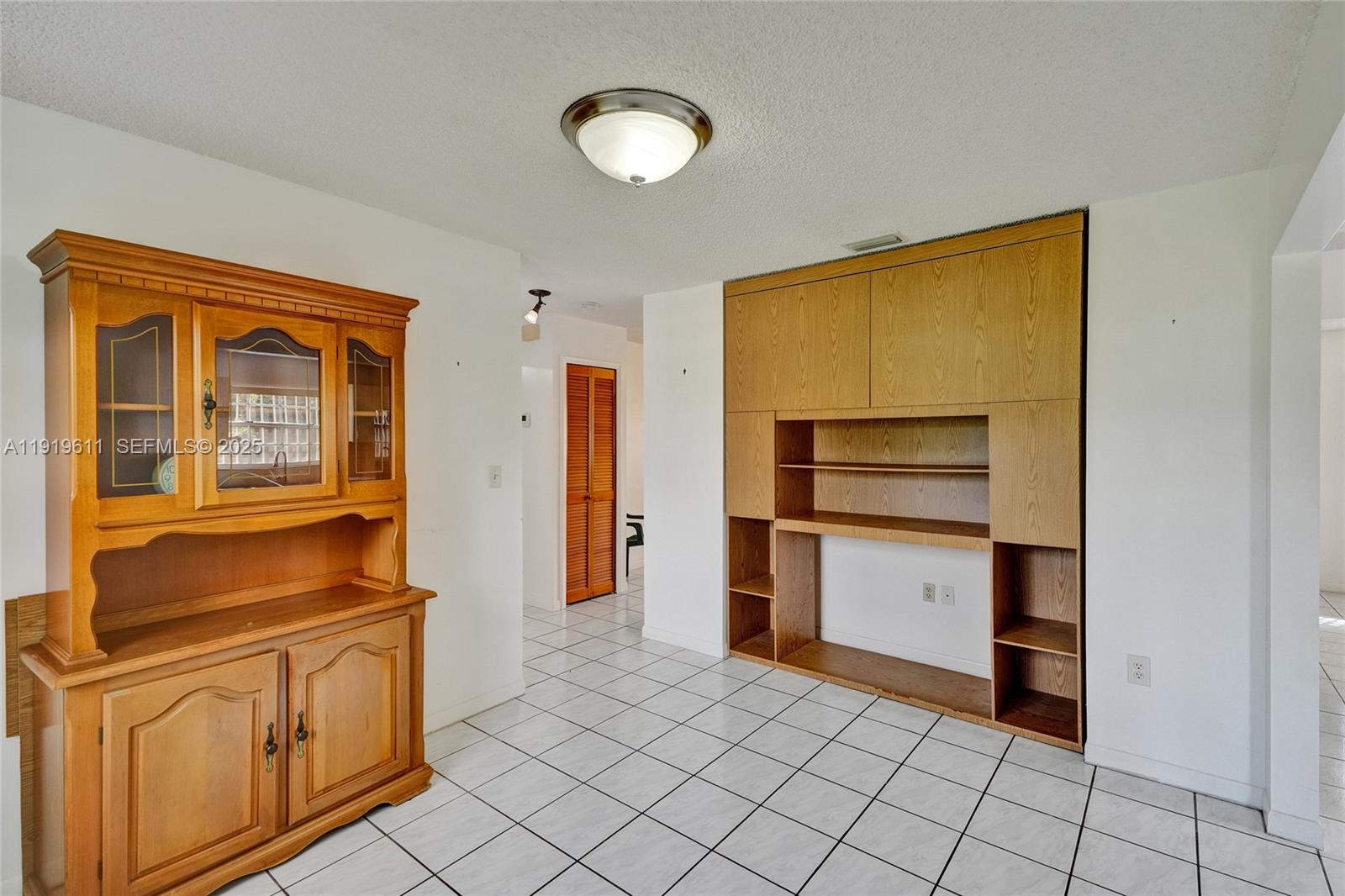 13401 Southwest 38th Street Miami, FL 33175 - Photo 21 of 45 a kitchen with stainless steel appliances granite countertop a refrigerator and a stove top oven