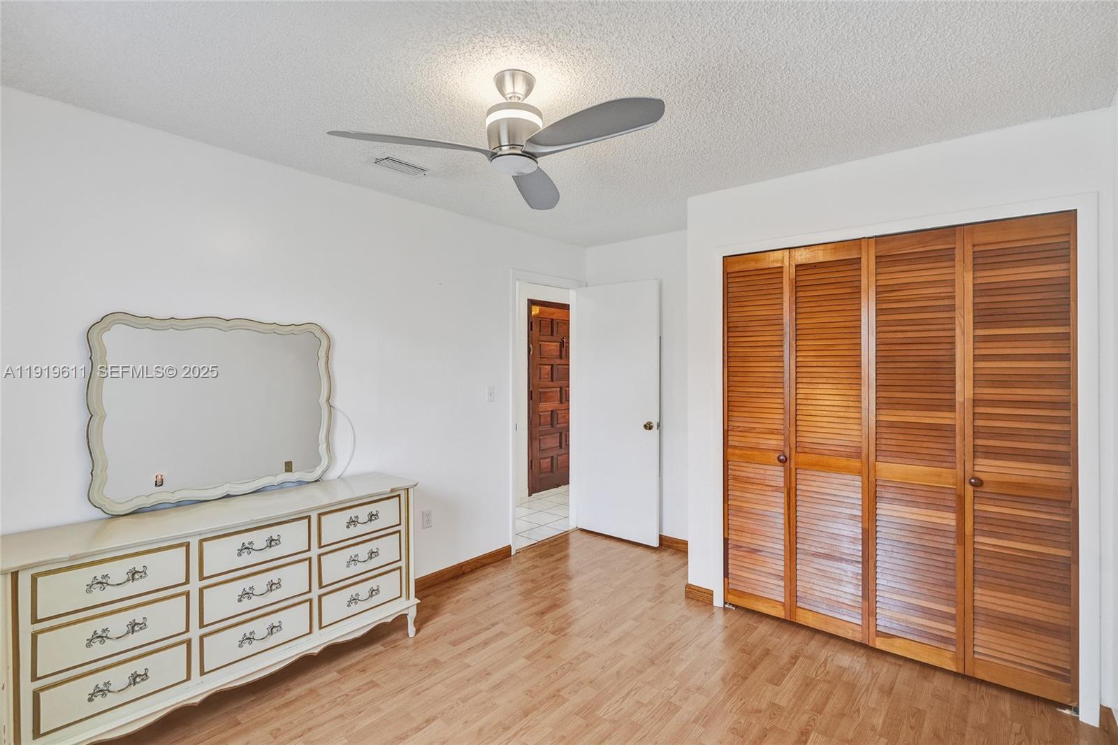 13401 Southwest 38th Street Miami, FL 33175 - Photo 41 of 45 a view of room with cabinet and wooden floor