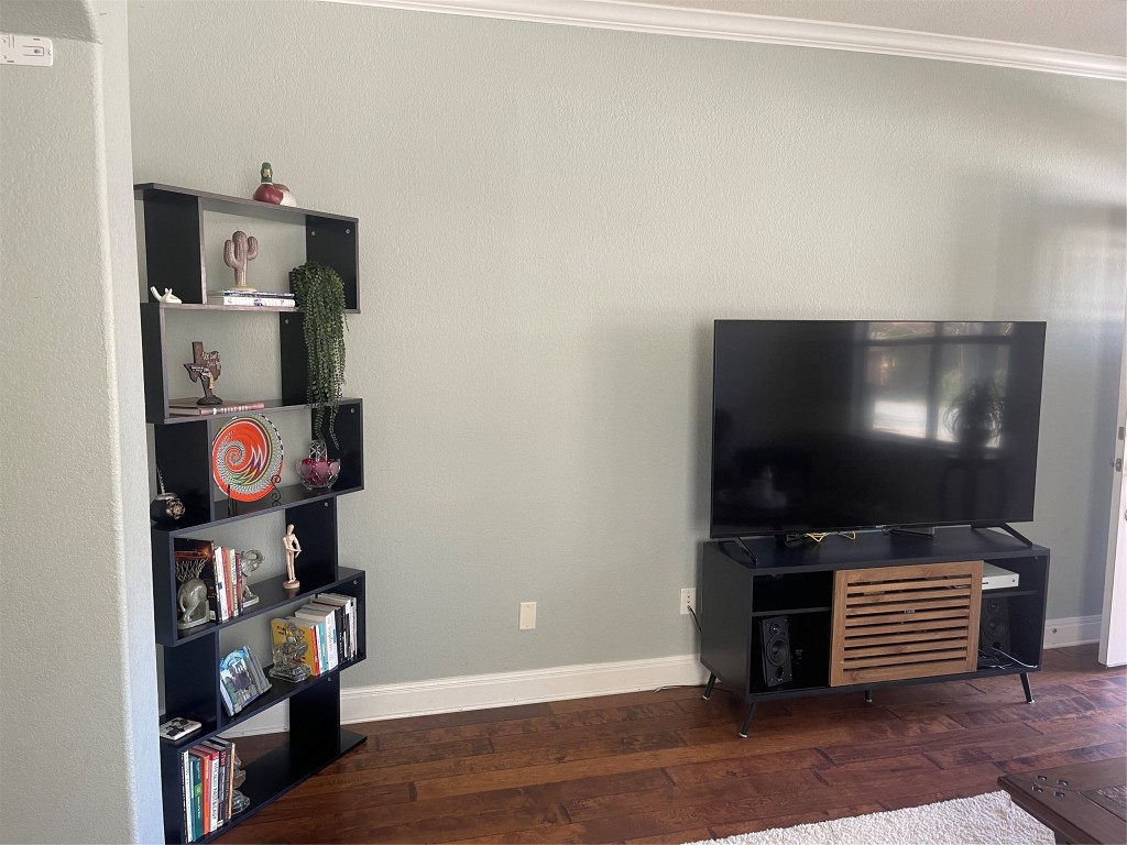 6708 Menchaca Road, Unit 11 Austin, TX 78745 - Photo 3 of 8 a room with furniture and wooden floor
