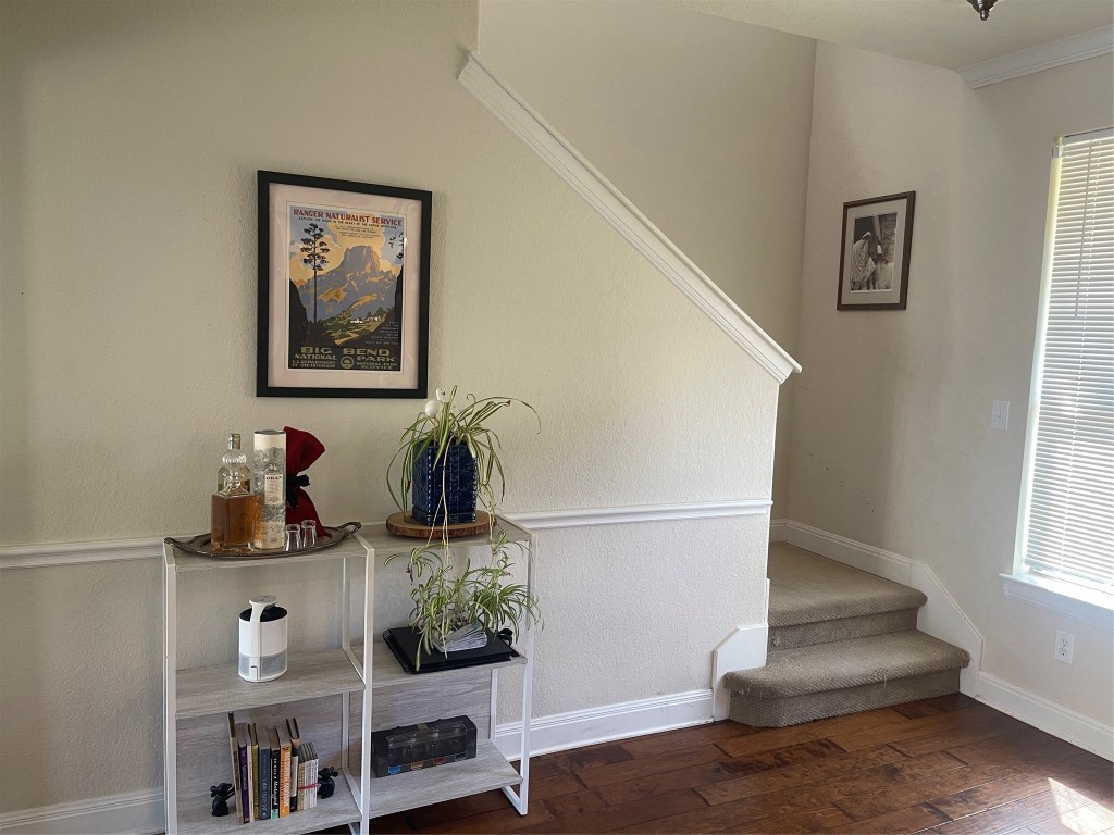 6708 Menchaca Road, Unit 11 Austin, TX 78745 - Photo 4 of 8 a living room with furniture and wooden floor