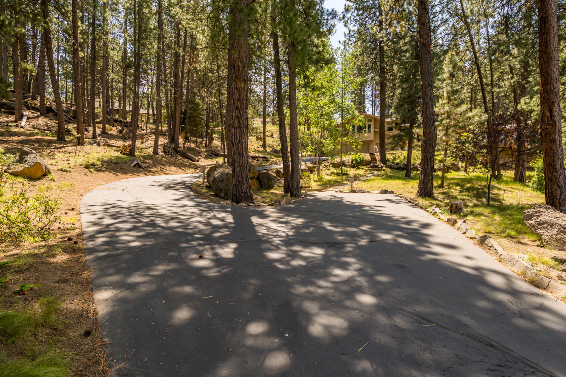 18841 Baker Road Bend, OR 97702 - Photo 5 of 60 a view of a yard with large trees