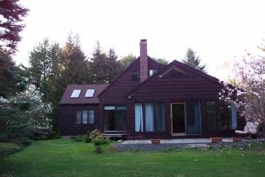 47 West Center Road West Stockbridge, MA 01266 - Photo 2 of 2 a front view of a house with a garden and plants