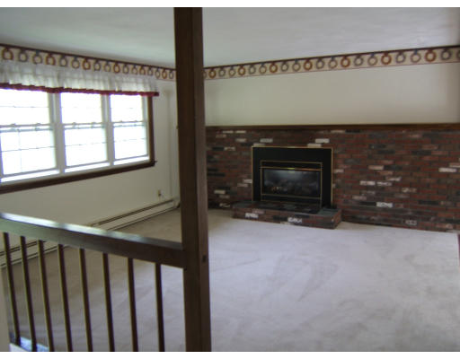 86 Purgatory Road Sutton, MA 01590 - Photo 13 of 16 a view of an empty room with a fireplace