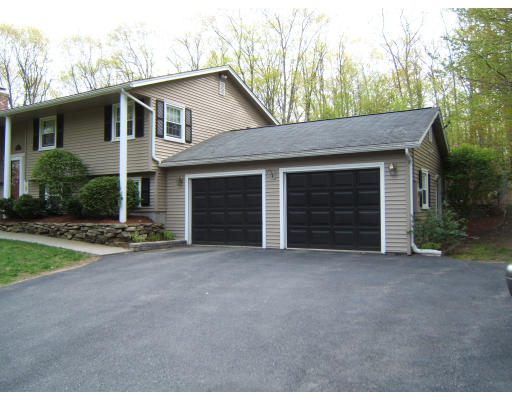 86 Purgatory Road Sutton, MA 01590 - Photo 4 of 16 a view of a house with a yard and garage